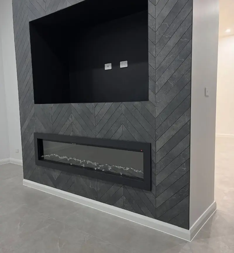 Chevron stone feature fireplace wall in West Pennant Hills with skirting and tile expansion joints sealed